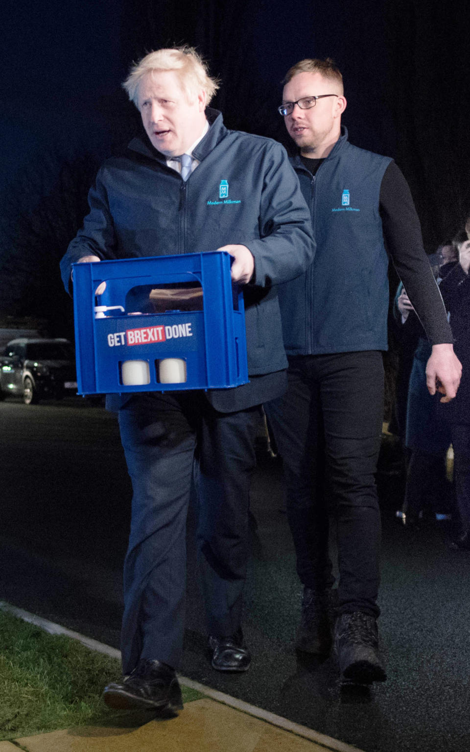 Prime Minister Boris Johnson delivers milk to Debbie Monaghan in Guiseley, Leeds, ahead of Thursday's General Election.