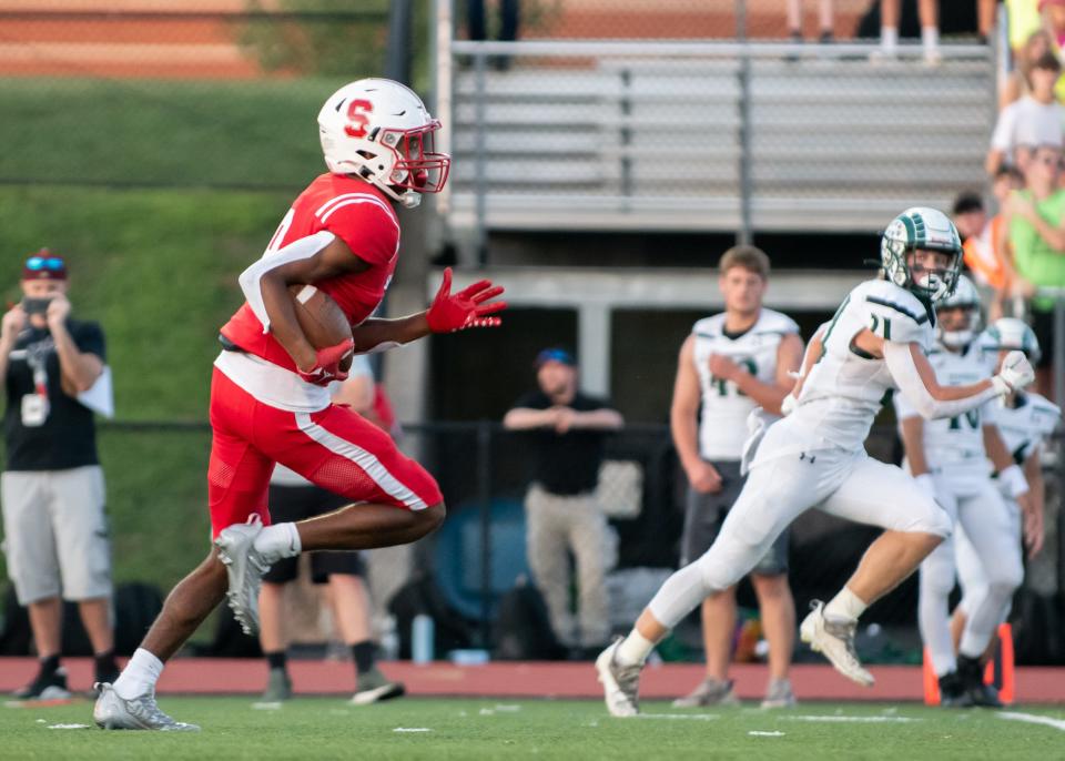 Souderton slotback Shaun Purvy runs the ball for a big gain against Pennridge during a football game at Souderton Area High School in Franconia Township on Friday, September 2, 2022.