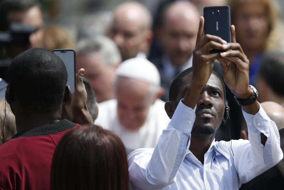 A man tries for a selfie with Pope Francis as he arrives in Saint Alexander Nevsky Square in Sofia, Bulgaria, Sunday, May 5, 2019. Pope Francis is visiting Bulgaria, the European Union's poorest country and one that taken a hard line against migrants, a stance that conflicts with the pontiff's view that reaching out to vulnerable people is a moral imperative. (AP Photo/Darko Vojinovic)