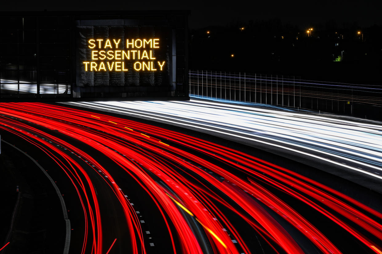 PLEASE NOTE: LONG EXPOSURE EFFECT WAS USED A stay home, essential travel only sign on the M1 Motorway near J25, Long Eaton, Derbyshire. (Photo by Scott Wilson/PA Images via Getty Images)