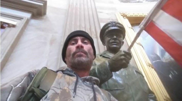 Anthony Robert Williams, of Southgate, poses in front of statues after breaking into the U.S. Capitol during the Jan. 6, 2021 insurrection.