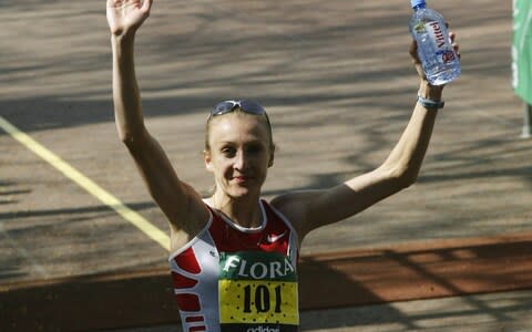 Paula Radcliffe first broke the marathon world record in Chicago in 2002 while fighting period cramps in the last third of the race - Credit: Getty Images