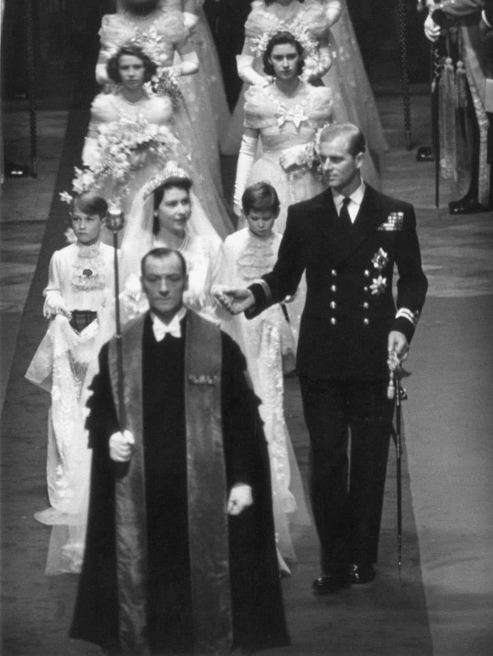 Princess Elizabeth and Prince Philip make their way down the aisle of Westminster Abbey, London, on their wedding day