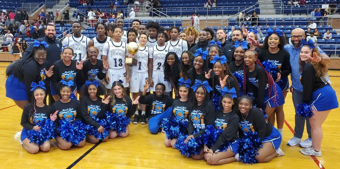 The Mansfield Summit basketball team and cheer squad pose with the Class 5A Region I quarterfinal trophy after the Jaguars 61-37 win over Mansfield Timberview on Feruary 28, 2023 at Mansfield High School in Mansfield, Texas.