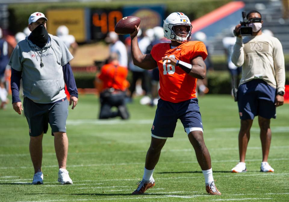 Auburn quarterback Dematrius Davis (18) throws during an open football practice at Jordan-Hare Stadium in Auburn, Ala., on Saturday, March 20, 2021.