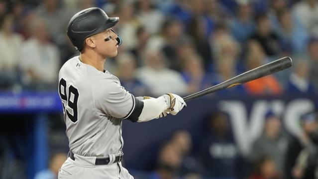 May 16, 2023; Toronto, Ontario, CAN; New York Yankees designated hitter Aaron Judge (99) watches his ball go over the center field wall for a two run home run against the Toronto Blue Jays during the eighth inning at Rogers Centre.