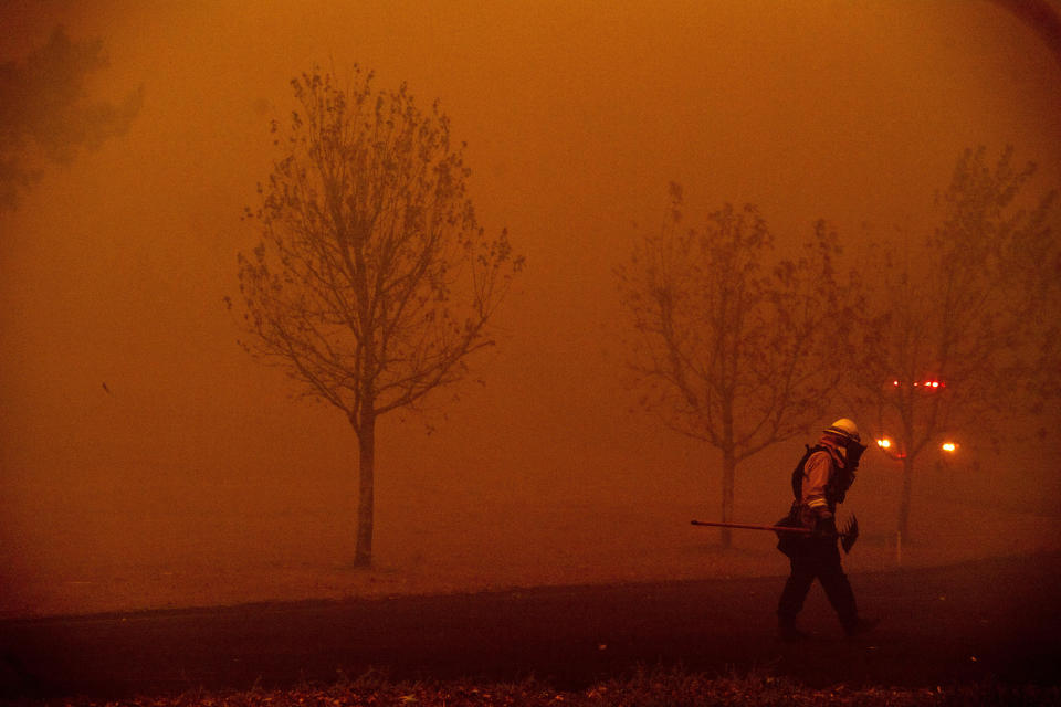 A firefighter battles a wildfire called the Kincade Fire in Healdsburg, Calif., Sunday, Oct. 27, 2019. With ferocious winds driving multiple wildfires through bone-dry vegetation and nearly 200,000 people ordered to leave their homes, California's governor declared a statewide emergency Sunday. (Photo: Noah Berger/AP)