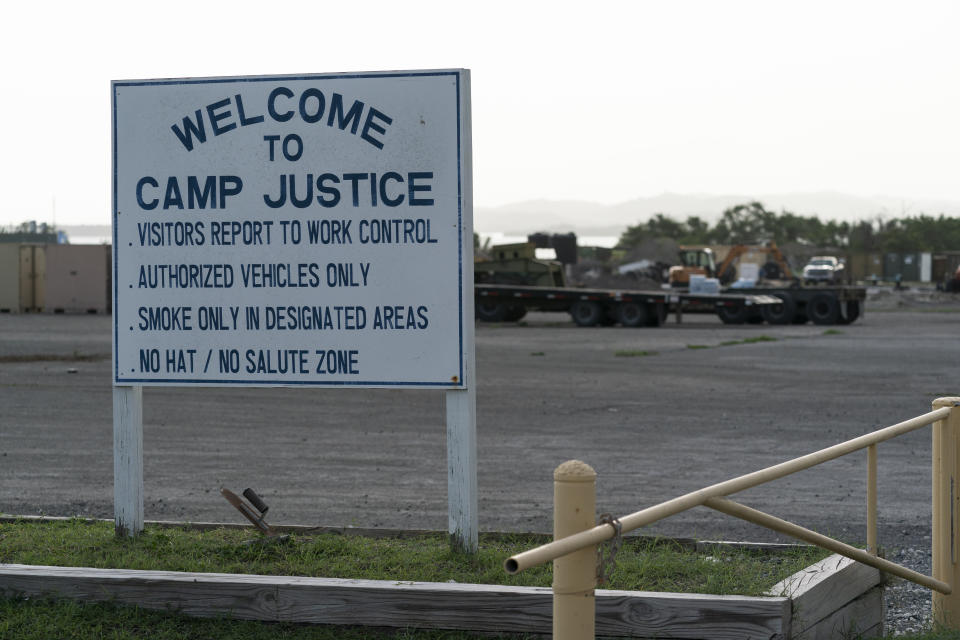 In this photo reviewed by U.S. military officials, a sign welcomes people to Camp Justice, Sunday, Aug. 29, 2021, in Guantanamo Bay Naval Base, Cuba. Camp Justice is where the military commission proceedings are held for detainees charged with war crimes. (AP Photo/Alex Brandon)