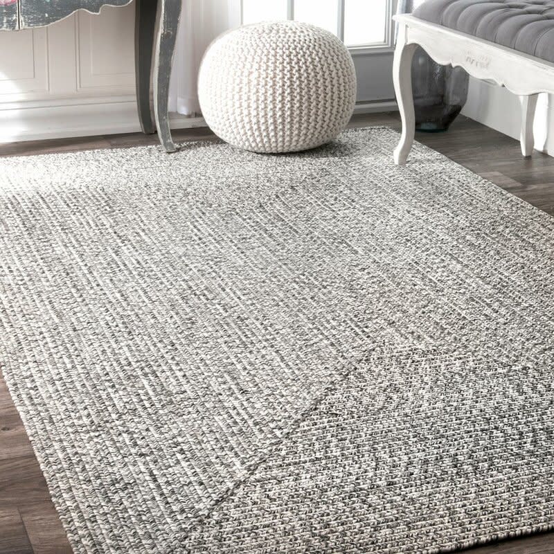 Kulpmont Hand-Braided Grey Indoor/Outdoor Area Rug. Image via Wayfair.