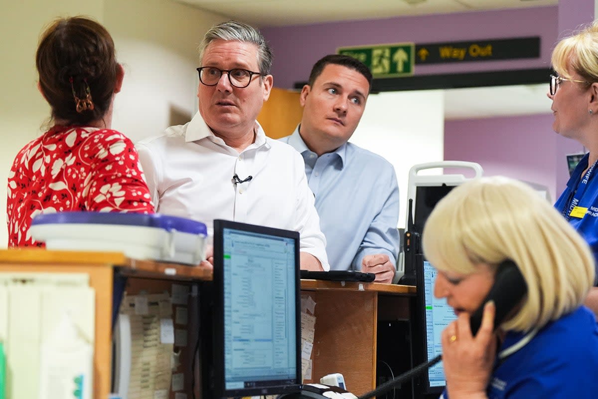 Labour leader Sir Keir Starmer (centre) and shadow health secretary Wes Streeting, meet nursing staff (Jacob King/PA Wire)