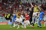 Morocco players celebrate after the World Cup group F soccer match between Belgium and Morocco, at the Al Thumama Stadium in Doha, Qatar, Sunday, Nov. 27, 2022. (AP Photo/Frank Augstein)