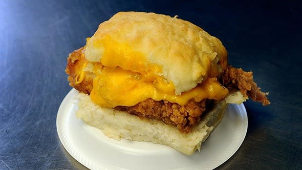 <p>Nothing says southern cooking quite like fried chicken and biscuits, so why not put them together in sandwich form? <a href="http://www.timeoutchapelhill.com/menu/" rel="nofollow noopener" target="_blank" data-ylk="slk:Time Out" class="link ">Time Out</a>, a popular stop for UNC Chapel Hill students, has a chicken and cheddar biscuit sandwich that won’t crumble in your hands. The chicken is fried with the bone for extra flavor, and the marinade has a Tabasco base for extra spice. Melted cheddar bonds the chicken to the biscuit, and together they make a heavy but delicious combination.</p><p><i>(Photo Courtesy of Time Out)</i></p>