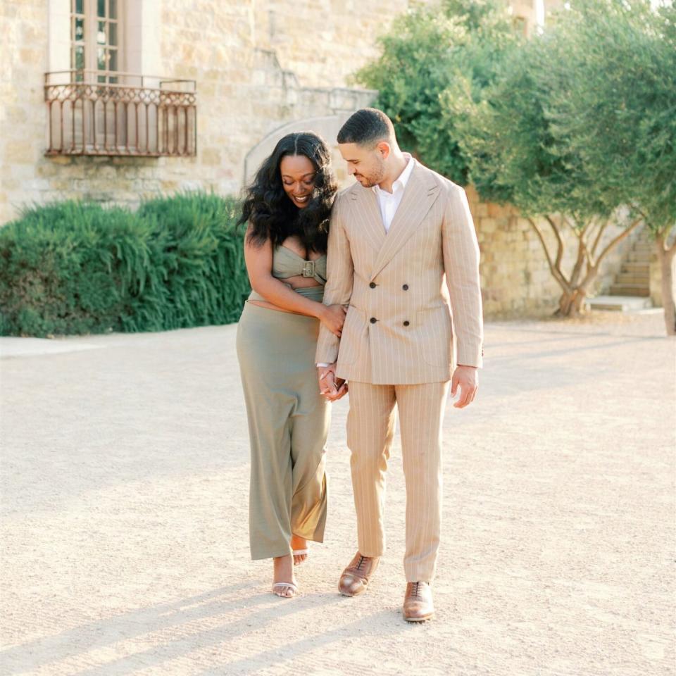 christonya orlando rehearsal dinner, couple walking together