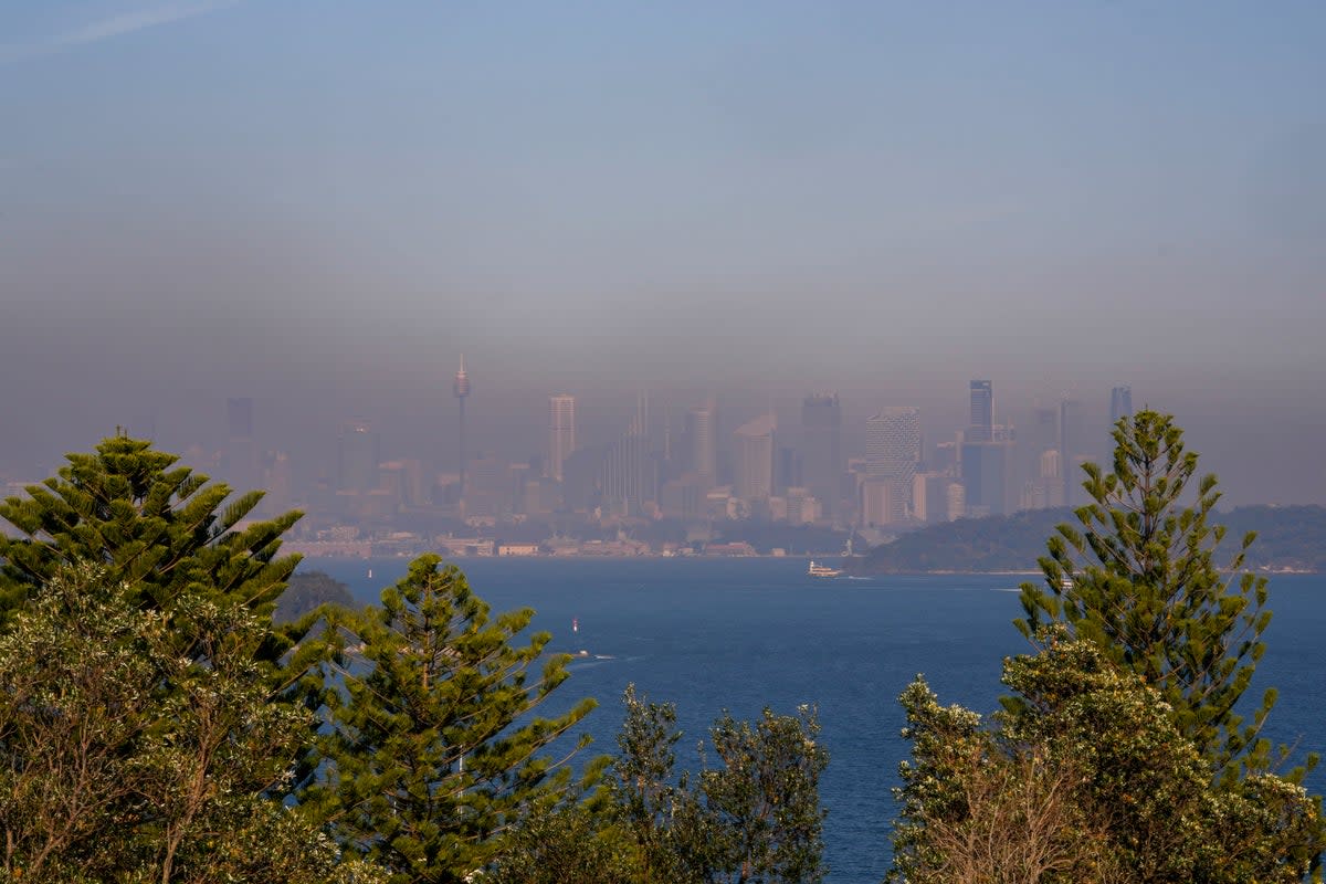 A thick a blanket of smoke hangs over parts of the Sydney following New South Wales Rural Fire Service (RFS) hazard reduction burns in the past week (AP)