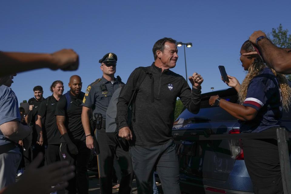 UConn head coach Jim Mora Jr., second from right, greets fans before a game against North Carolina State in East Hartford, Conn., Thursday, Aug. 31, 2023. Mora and his winless Huskies play host to 1-3 Utah State on Saturday. | Bryan Woolston, Associated Press