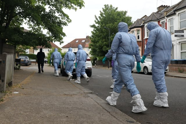 Police forensic officers looking for evidence