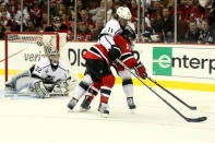 NEWARK, NJ - JUNE 09: Stephen Gionta #11 of the New Jersey Devils goes for a loose puck against Anze Kopitar #11 of the Los Angeles Kings in front of Jonathan Quick #32 during Game Five of the 2012 NHL Stanley Cup Final at the Prudential Center on June 9, 2012 in Newark, New Jersey. (Photo by Elsa/Getty Images)