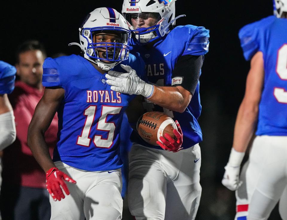 Hamilton Southeastern Royals Mason Alexander (15) celebrates a touchdown with teammates Friday, Aug. 18, 2023, during the game against the Fort Wayne Carroll Chargers at Hamilton Southeastern High School in Fishers. The Hamilton Southeastern Royals defeated the Fort Wayne Carroll Chargers, 23-14.