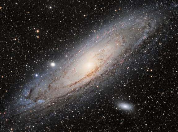 Astronomers have spotted a possible signal of dark matter in X-rays streaming from the Andromeda galaxy (pictured) and the Perseus galaxy cluster.