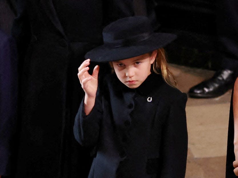 Kate Middleton, Meghan Markle, Prince George, and Princess Charlotte at Queen Elizabeht II's funeral.