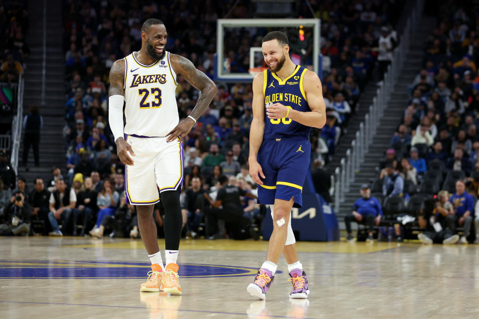 SAN FRANCISCO, CALIFORNIA - JANUARY 27: Stephen Curry #30 of the Golden State Warriors and LeBron James #23 of the Los Angeles Lakers joke with each other during the game at Chase Center on January 27, 2024 in San Francisco, California. NOTE TO USER: User expressly acknowledges and agrees that by downloading and/or using this photograph, User is agreeing to the terms and conditions of the Getty Images License Agreement. (Photo by Ezra Shaw/Getty Images)