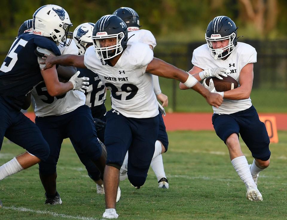 North Port's running back Maddox Wittebort (2) gains a few yards. Parrish Community Bulls wins big 43-0 over the North Port Bobcats during a home game played at Parrish Community High School in Parrish, Friday night, August 25, 2023.