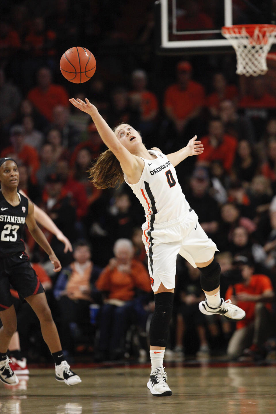 Oregon State's Mikayla Pivec (0) jumps backward to catch a pass from a teammate during the second half of an NCAA college basketball game against Stanford in Corvallis, Ore., Sunday, Jan. 19, 2020. (AP Photo/Amanda Loman)
