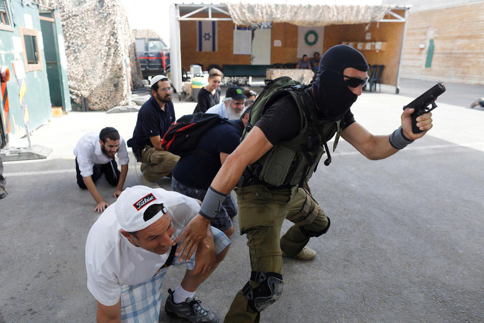 <p>A group of tourists take part in a two hour “boot camp” experience, at “Caliber 3 Israeli Counter Terror and Security Academy ” in the Gush Etzion settlement bloc south of Jerusalem in the occupied West Bank July 13, 2017. (Photo: Nir Elias/Reuters) </p>