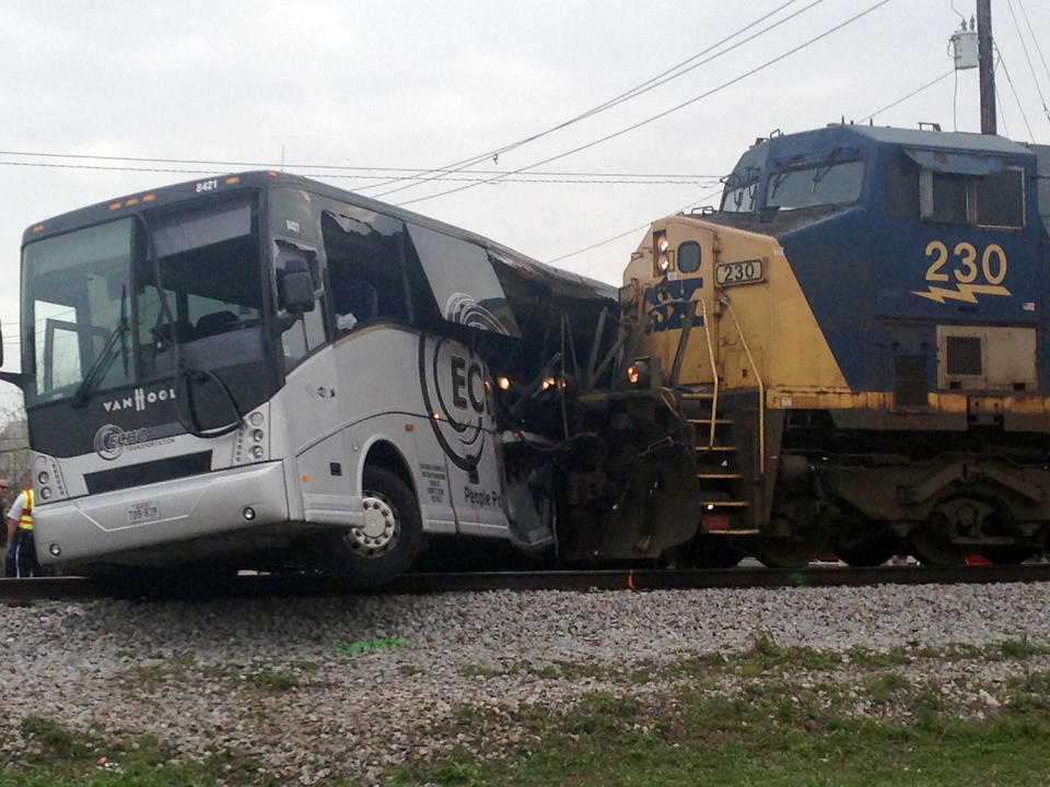 Train hits bus, killing 4