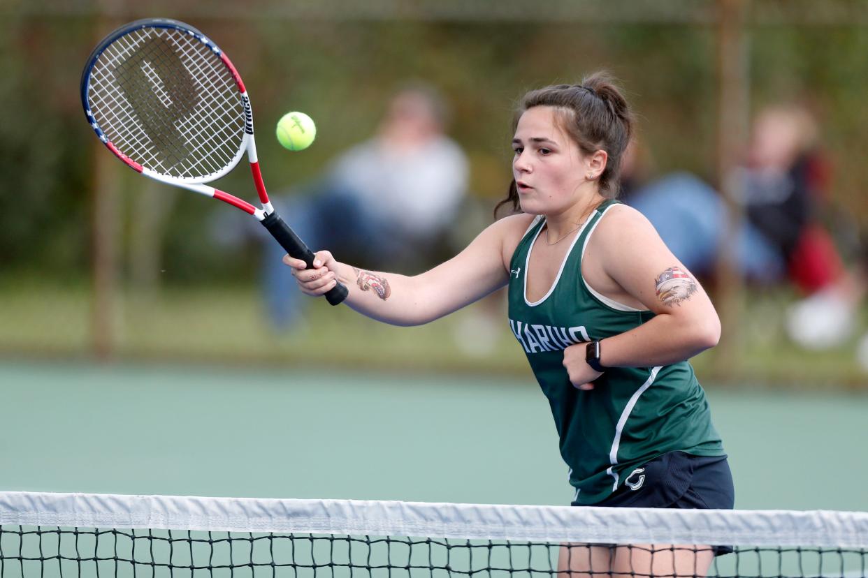 Chariho's Sara Johnson puts away a forehand volley during her match at No. 1 doubles with partner Allison Cole.