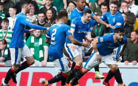 Daniel Candeias (right) celebrates scoring his side's second goal - Credit: PA