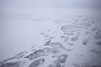 An aerial view of Alexandra Land island of the Franz Josef Land archipelago, Russia, Monday, May 17, 2021. Once a desolate home mostly to polar bears, Russia's northernmost military outpost is bristling with missiles and radar and its extended runway can handle all types of aircraft, including nuclear-capable strategic bombers, projecting Moscow's power and influence across the Arctic amid intensifying international competition for the region's vast resources. (AP Photo/Alexander Zemlianichenko)