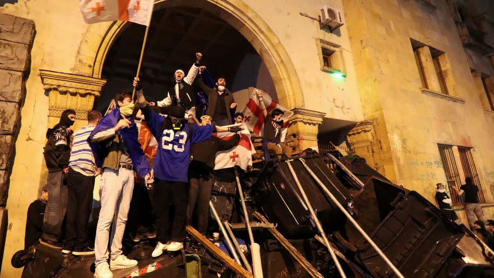 Protesters barricade an entrance to Parliament during a rally, May 2, 2024. - Irakli Gedenidze/Reuters