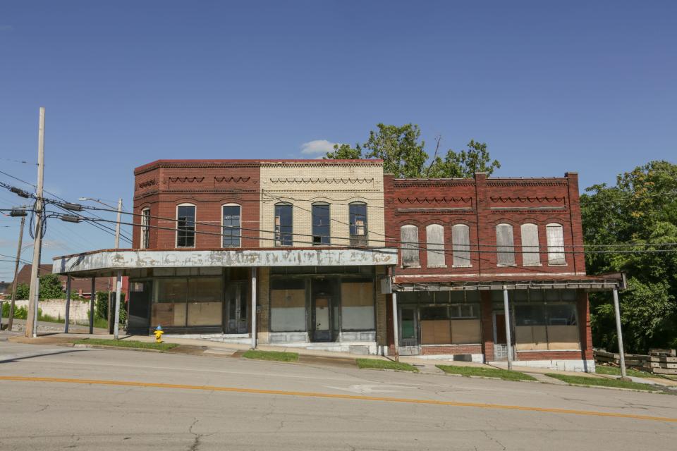 A row of unoccupied buildings line South Main Street at the intersection of East 8th Street in Columbia, Tenn., on Tuesday, June 22, 2021.