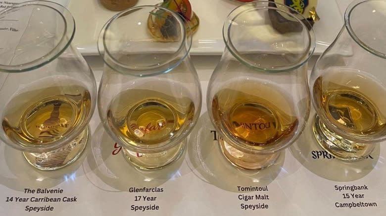 Scotch tasting glasses full of whisky on display