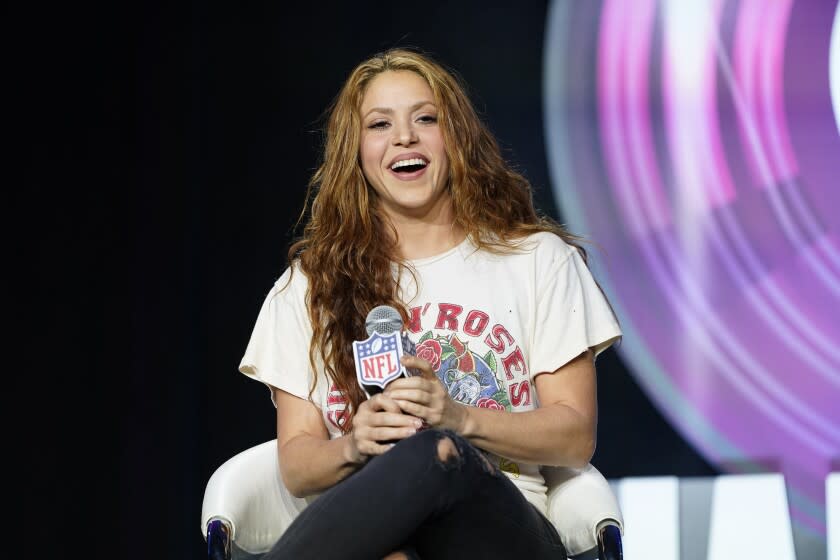 FILE - Performer Shakira answers questions at a news conference on Jan. 30, 2020, in Miami. Spanish prosecutors are seeking a prison sentence of eight years for Colombian-born pop star Shakira in her expected trial for alleged tax fraud. Shakira is charged for failing to pay 14,5 million euros ($15 million) in taxes in Spain between 2012 and 2014. Prosecutors say the singer lived in Spain for more than half of each of those years and should have therefore paid her taxes in the country. (AP Photo/David J. Phillip, File)