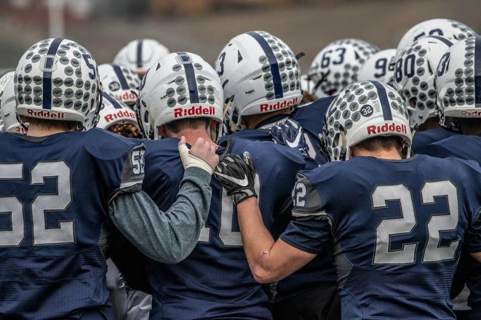 Chiawana HS Football players huddle