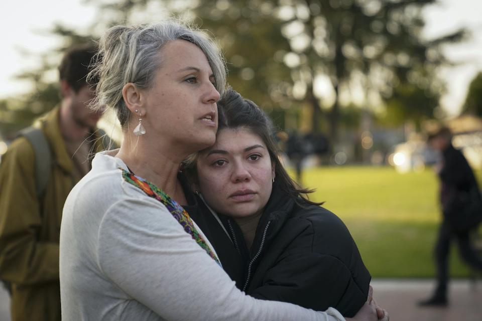 Jolie Slater, right, and Beth Paz, from Lake Avenue Church, embrace each other at a gathering held to honor the victims killed in the Jan. 21, 2023, ballroom dance studio shooting in Monterey Park, Calif. <a href="https://newsroom.ap.org/detail/CaliforniaShooting/7027b43e6ead4afa93ae360e3de6f86e/photo?Query=monterey%20park%20shooting&mediaType=photo&sortBy=&dateRange=Anytime&totalCount=79&currentItemNo=11" rel="nofollow noopener" target="_blank" data-ylk="slk:AP Photo/Jae C. Hong;elm:context_link;itc:0;sec:content-canvas" class="link ">AP Photo/Jae C. Hong</a>