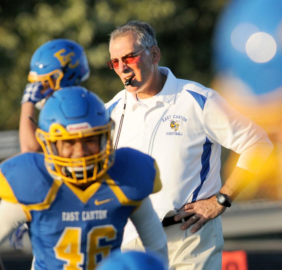 East Canton head coach John "Spider" Miller looks on as his team prepares to play Sandy Valley on Oct. 13, 2017.