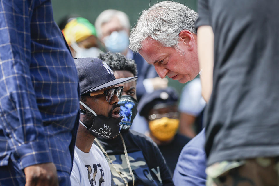 Terrence Floyd, brother of the deceased George Floyd, left, speaks with New York City Mayor Bill de Blasio during a rally at Cadman Plaza Park, Thursday, June 4, 2020, in the Brooklyn borough of New York. Protests continued following the death of George Floyd, who died after being restrained by Minneapolis police officers on May 25. (AP Photo/John Minchillo)