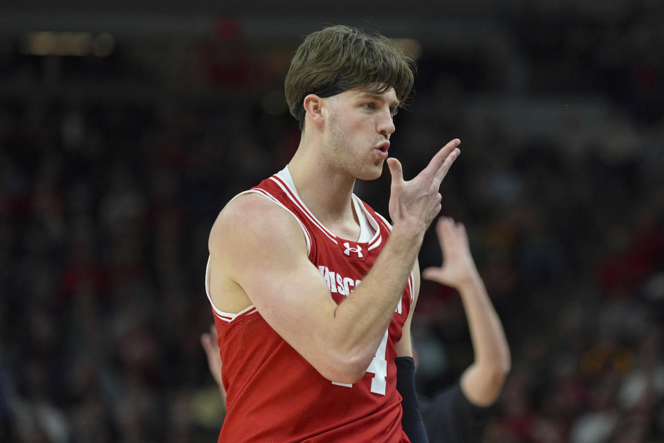Wisconsin forward Carter Gilmore celebrates after scoring a 3-point shot during the second half of an NCAA college basketball game against Purdue in the semifinal round of the Big Ten Conference tournament, Saturday, March 16, 2024, in Minneapolis. (AP Photo/Abbie Parr)
