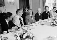 FILE - In this June 2, 1977 file photo, President Jimmy Carter hosts a breakfast in the Family Dining Room of the White House in Washington for House Subcommittee members on Energy and Power. From left are Rep. John M. Murphy (D-N.Y.), Rep. John Dingell (D-Mich.), President Carter, Rep. Harley Staggers (D-W Va.), Rep. Andrew Maguire (D-N.J.), and Rep. Timothy Wirth (D-Colo.). Dingell, the longest-serving member of Congress in American history who mastered legislative deal-making and was fiercely protective of Detroit's auto industry, has died at age 92. Dingell, who served in the U.S. House for 59 years before retiring in 2014, died Thursday, Feb. 7, 2019, at his home in Dearborn, said his wife, Congresswoman Debbie Dingell. (AP Photo/Charles Harrity, File)