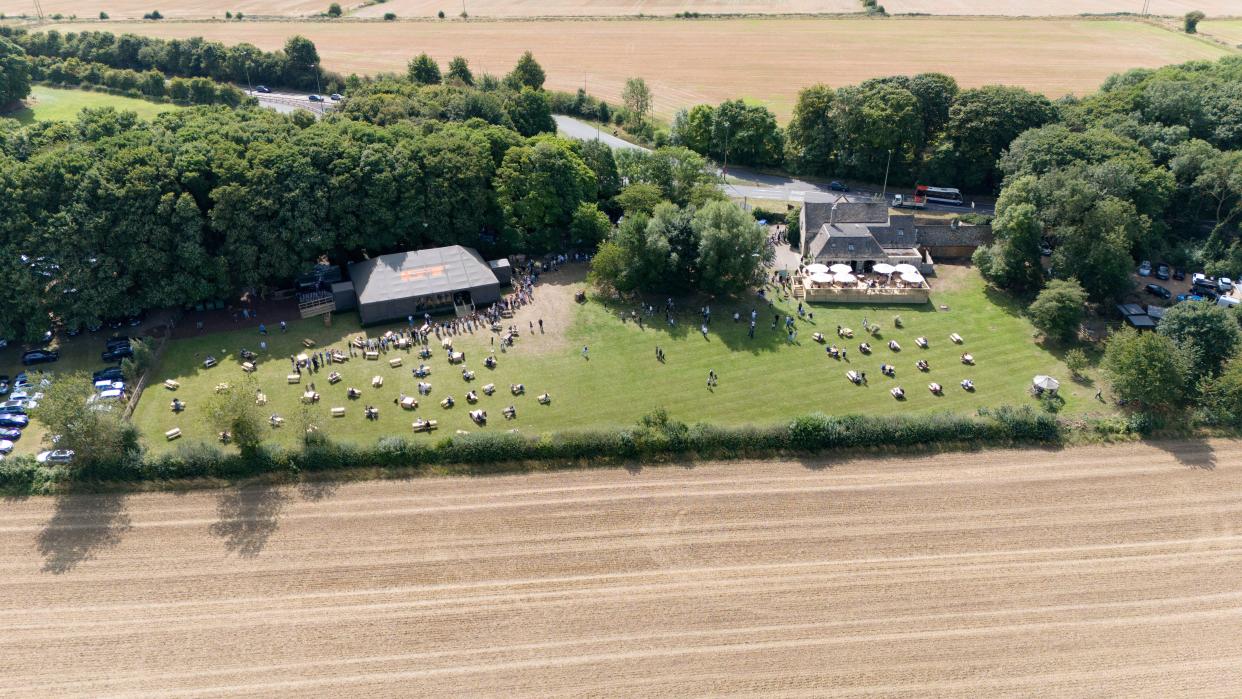 People queuing outside at the opening of Jeremy Clarkson's new pub, The Farmer's Dog, in Asthall, near Burford in Oxfordshire. Picture date: Friday August 23, 2024.