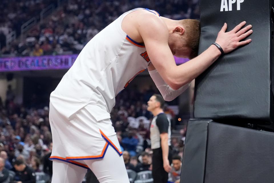 New York Knicks guard Donte DiVincenzo reacts after missing a basket in the first half of an NBA basketball game against the Cleveland Cavaliers, Sunday, March 3, 2024, in Cleveland. (AP Photo/Sue Ogrocki)