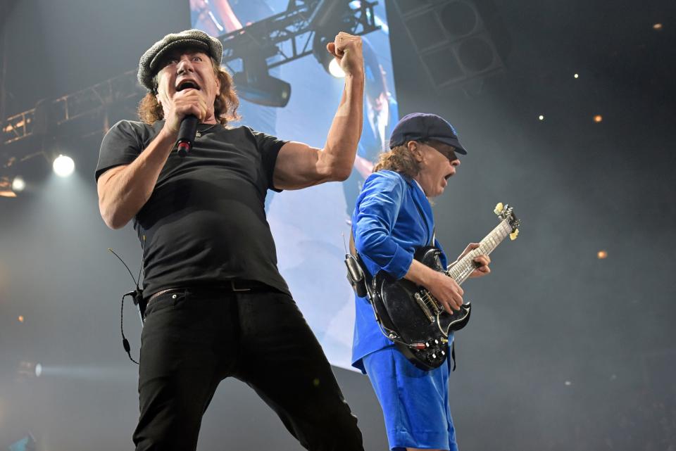 Brian Johnson, left, and Angus Young, of AC/DC, perform in Chicago in 2016. Their new album "Power Up" is out Friday.