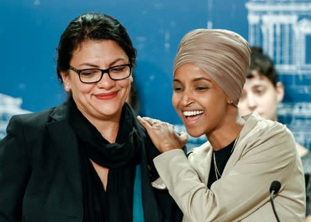 U.S. Representatives Rashida Tlaib and Ilhan Omar react as they discuss travel restrictions to Palestine and Israel during a news conference in St Paul