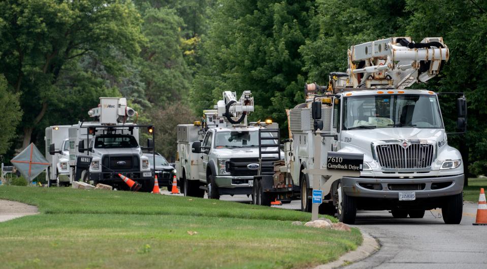 Meade (out of Chicago) and Wright Tree Service work on areas without power on Camelback Drive, Monday, July 3, 2023 and the area. The companies are contracted by AES.