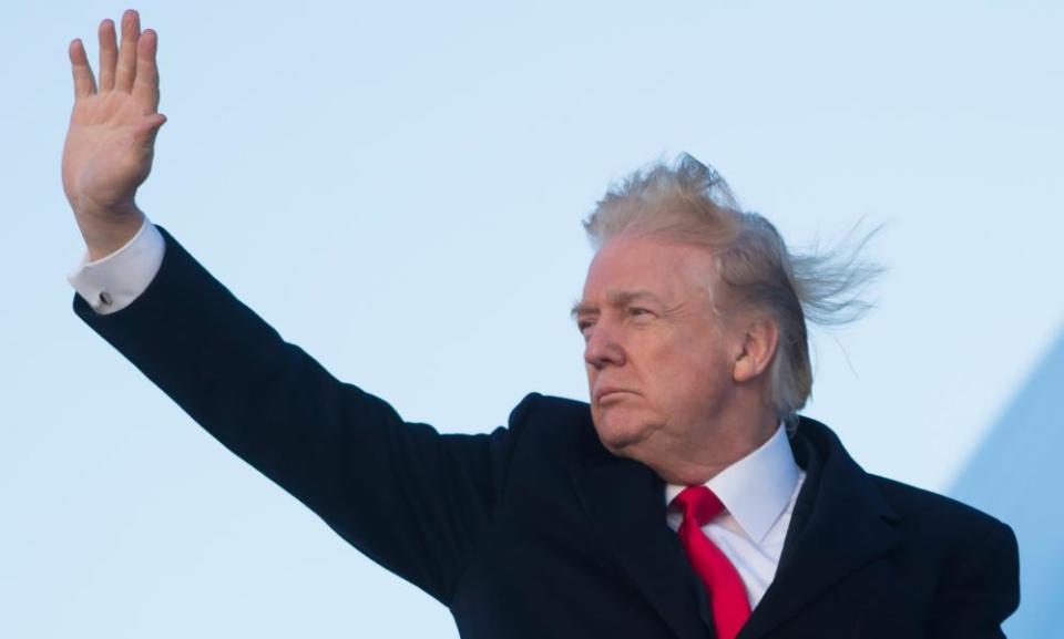 Donald Trump waves from Air Force One before departure from Joint Base Andrews in Maryland on Friday as he travels to Mar a Lago in West Palm Beach, Florida, for the weekend.