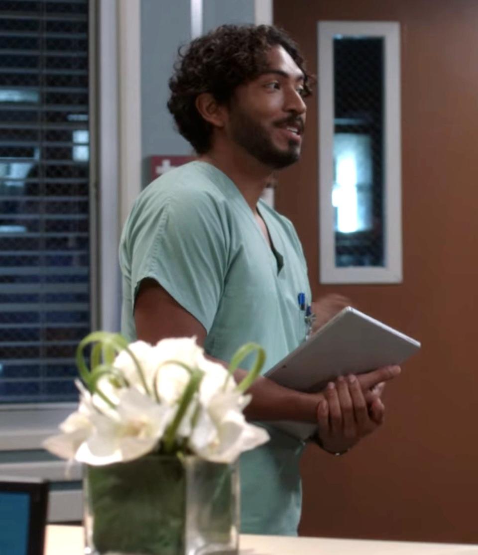 A nurse holding a tablet