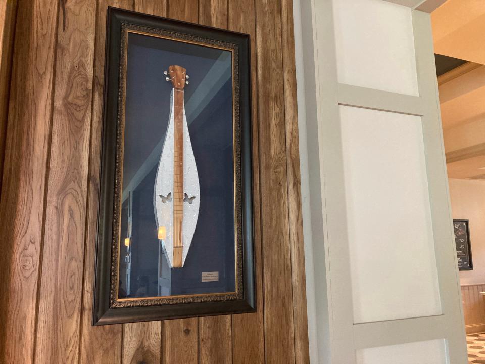 Dolly Parton's instruments framed and on display at the Dollywood DreamMore Resort.